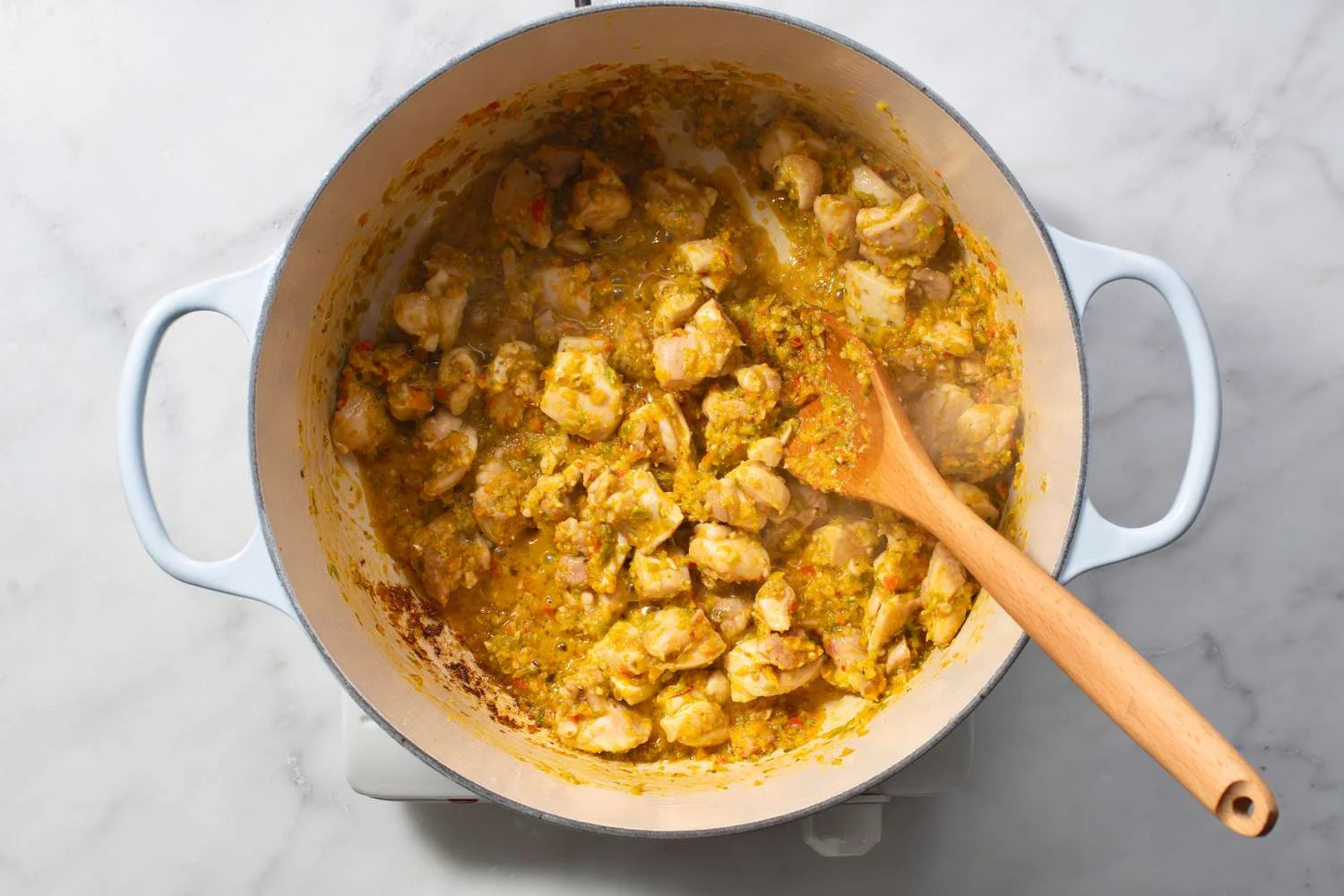 chicken meat added to pot