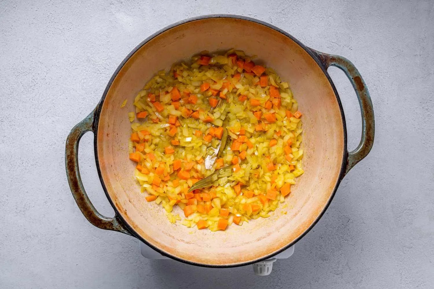 Carrots, onions cooking in a pot