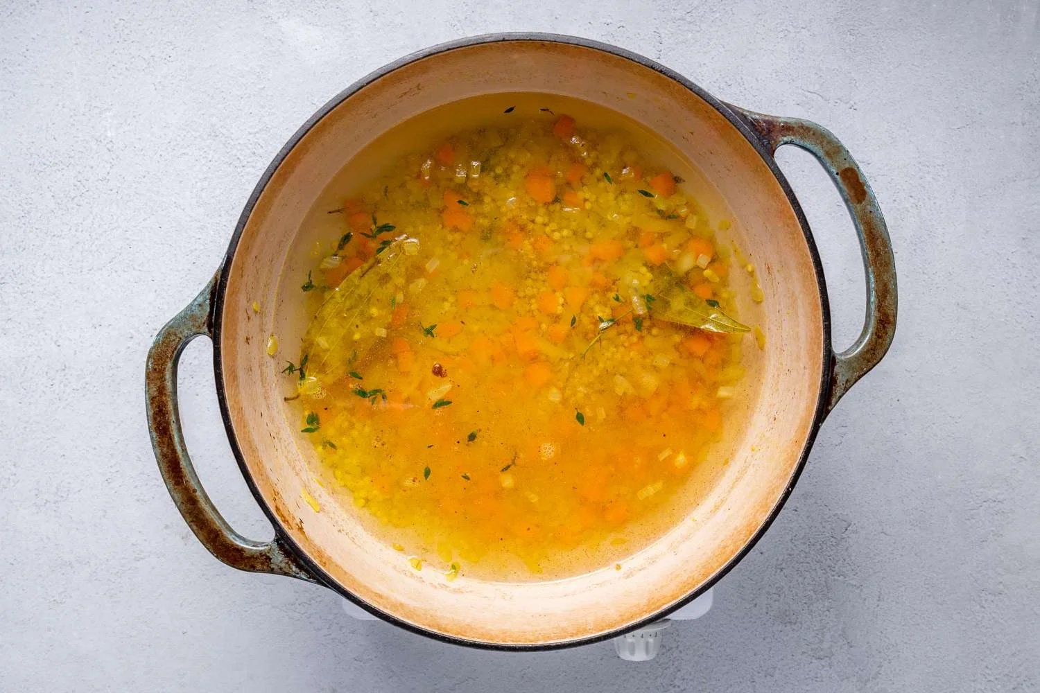 Broth added to the pot