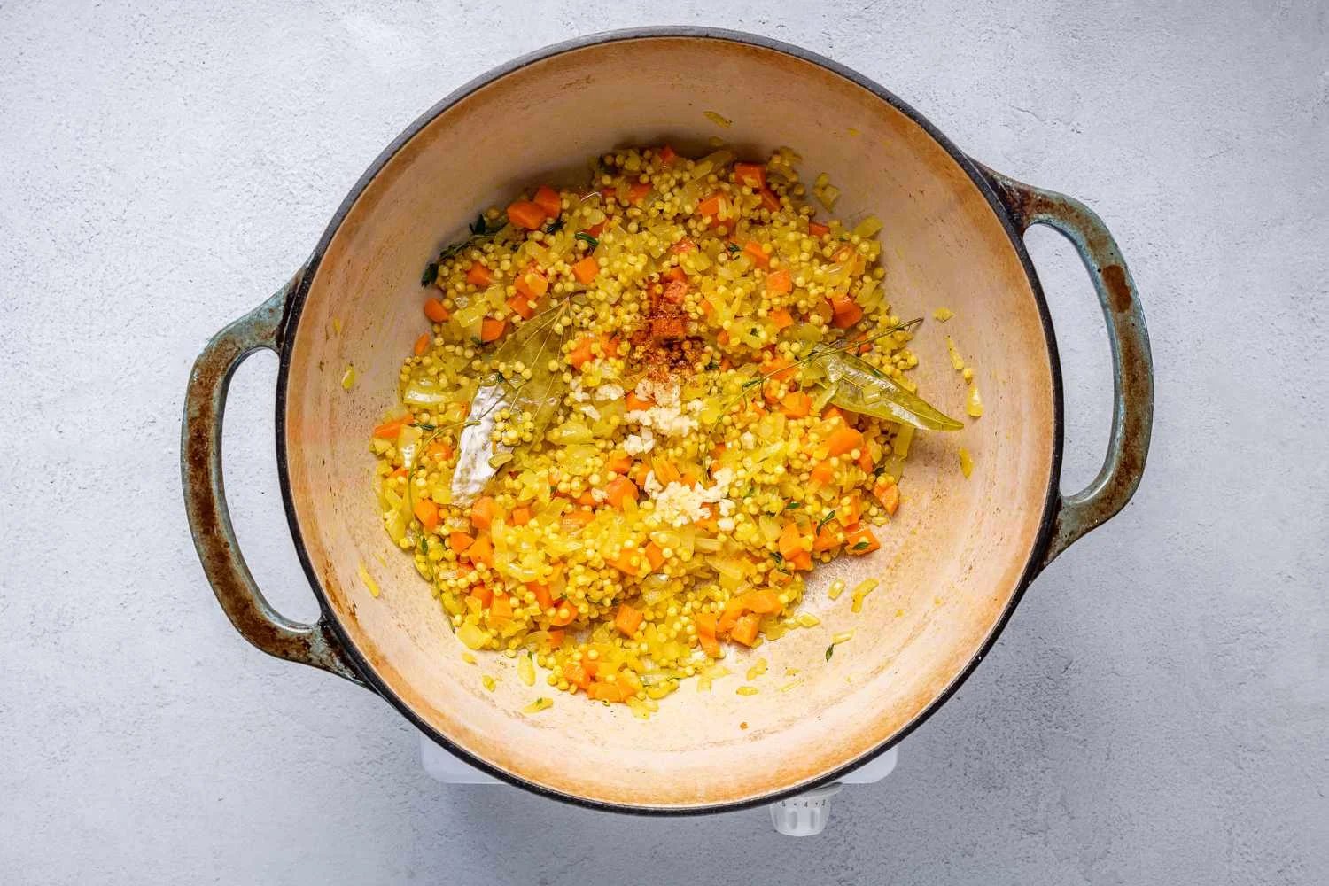 Adding garlic to the pot