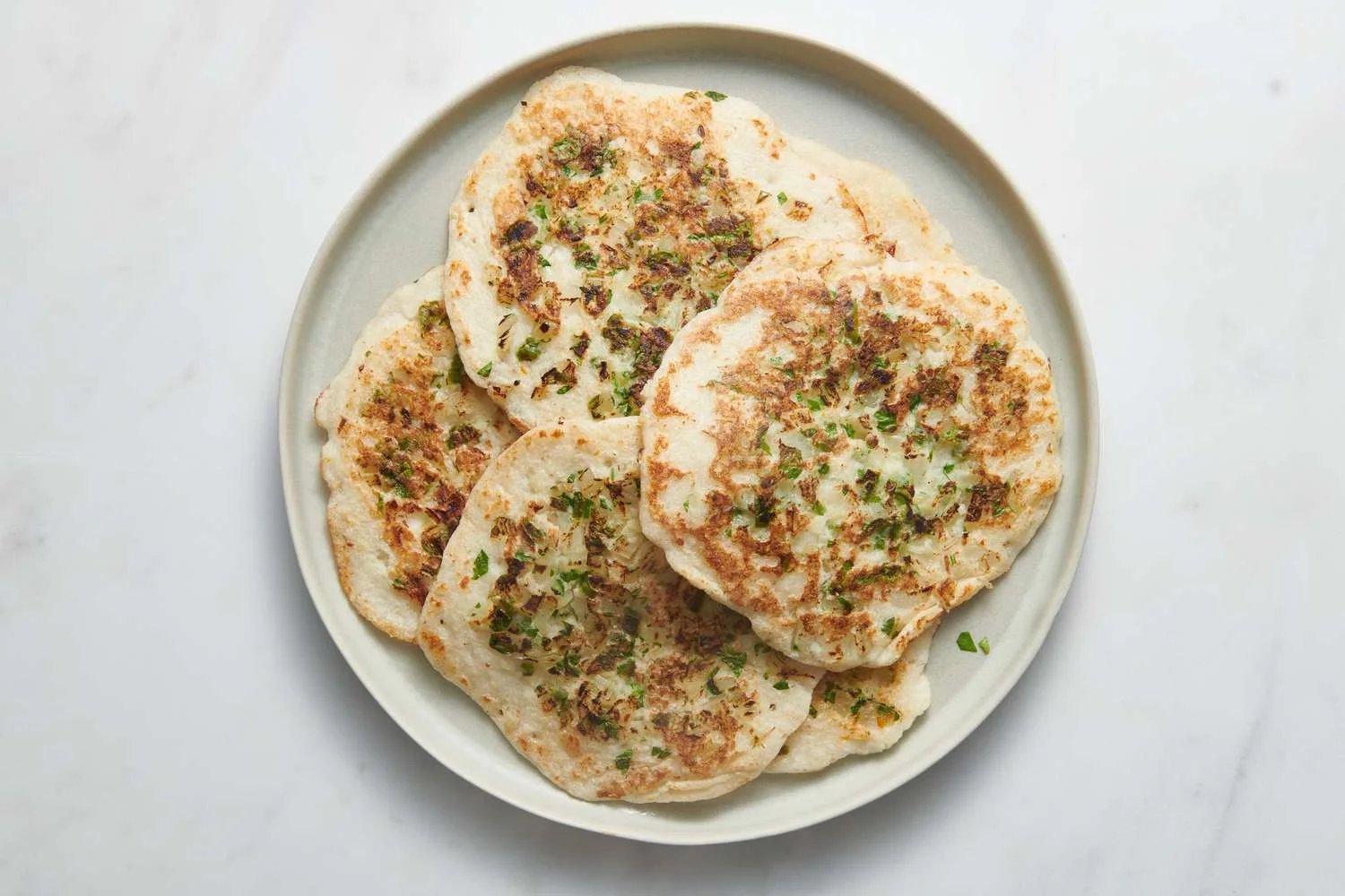 Platter of cooked uttapam