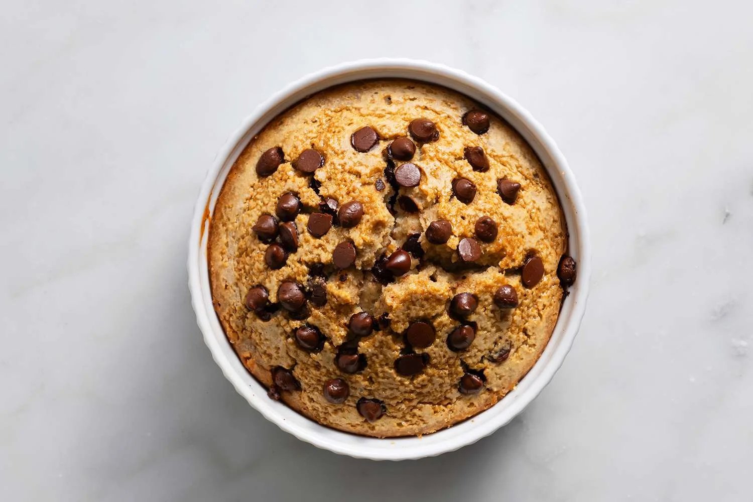 Blended Baked Oats with chocolate chips in a ramekin