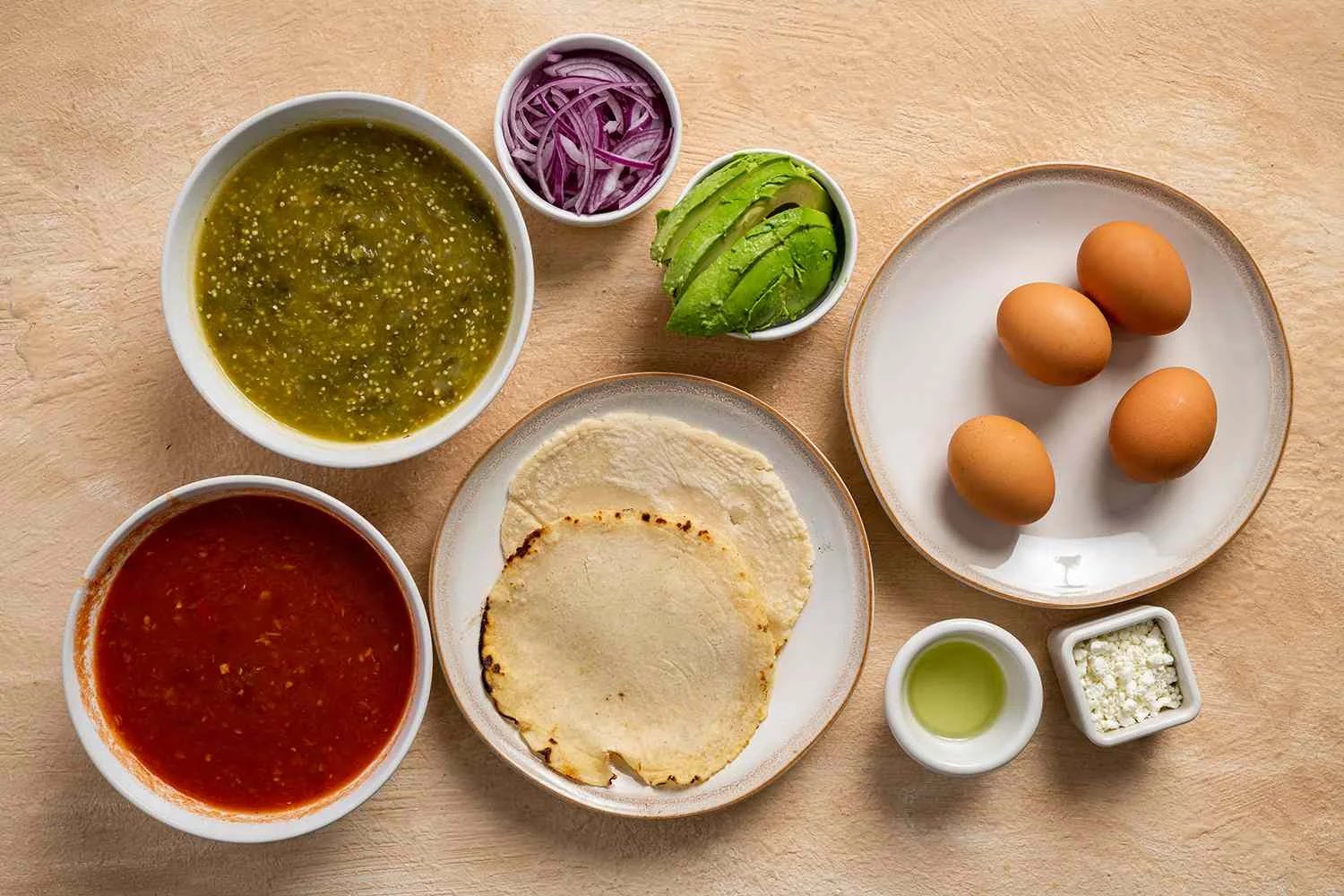 Huevos Divorciados ingredients in bowls 