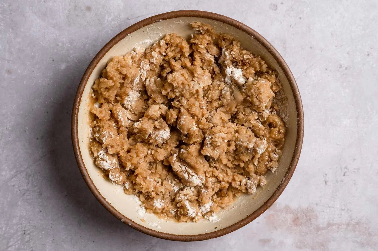 A crumbly mixture of flour, brown sugar, butter, cinnamon, and vanilla extract