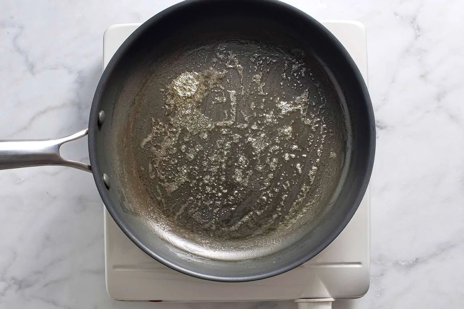 Butter melted and bubbling in a non-stick skillet.